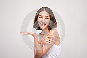 Beautiful Attractive Charming Asian young woman smile with white teeth open hand palm