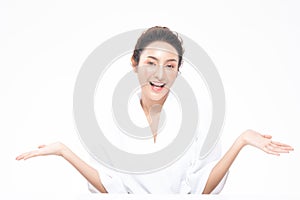 Beautiful Attractive Charming Asian young woman smile with white teeth open hand palm for display cosmetics product cheerful with