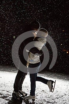 Beautiful, attractive couple on the ice rink