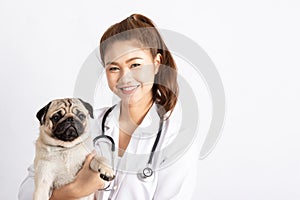 Beautiful Attractive Young Asian Veterinarian Woman smile with dog pug breed at the veterinarian clinic feeling so happiness and c