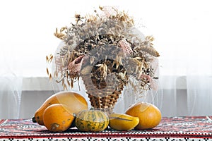 Beautiful autumn composition of basket with healing herbs dried