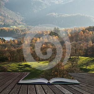 Beautiful Autumn Fall landscape image of the view from Catbells in the Lake District with vibrant Fall colors being hit by the