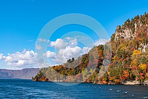 Beautiful autumn foliage scenery landscapes. View from Lake Towada sightseeing Cruise ship
