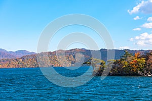 Beautiful autumn foliage scenery landscapes. View from Lake Towada sightseeing Cruise ship