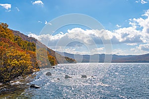 Beautiful autumn foliage scenery landscapes. View from shore of Lake Towada