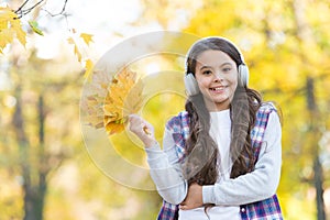 So beautiful. autumn kid fashion. inspiration. happy childhood. back to school. girl with maple leaves relax in park