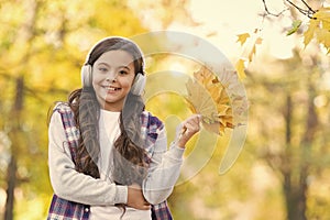 So beautiful. autumn kid fashion. inspiration. happy childhood. back to school. girl with maple leaves relax in park