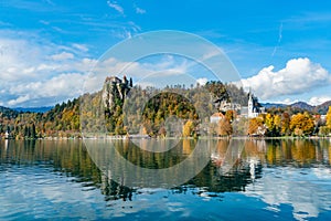 Beautiful autumn landscape around Lake Bled with the castle and St. Martin's Parish Church