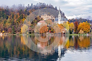 Beautiful autumn landscape around Lake Bled with St. Martin's Parish Church