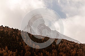 Beautiful autumn landscape with clouds on Matterhorn Peak in Zermatt area