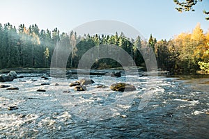 Beautiful autumn landscape on river Kymijoki near the Emperor Alexander lll fishing lodge Langinkoski. Kotka, Finland photo