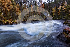 Beautiful autumn landscape with the river and old building, Oulanka National park, Finland