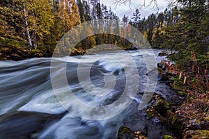 Beautiful autumn landscape with the river and old building, Oulanka National park, Finland
