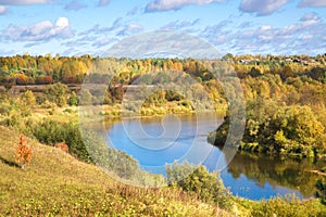 Beautiful autumn landscape with a river in a rural area