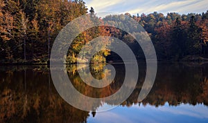 Beautiful autumn landscape scenery of forest reflected in Lake at TrakoÅ¡Ä‡an in Croatia, county hrvatsko zagorje
