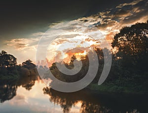 Beautiful autumn landscape, sunset in the forest with reflection