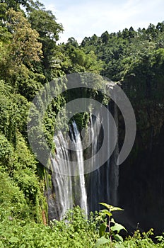 Beautiful autumn landscape waterfall in indonesia at tumpak sewu waterfall