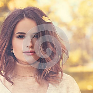 Beautiful Autumn Model Woman with Curly Bob Hairdo