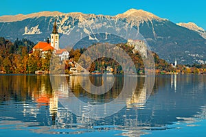Beautiful autumn scenery with famous buildings, lake Bled, Slovenia