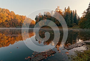 Beautiful autumn sunrise scenery of TrakoÅ¡Ä‡an Castle on the hill reflected in the lake in Croatia, county hrvatsko zagorje