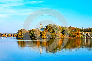 Beautiful autumn sunset on the River Dnieper, Christian Church in the Monastic island, Dnepr City, Ukraine