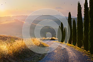 Beautiful autumn winding country road leading through rural countryside