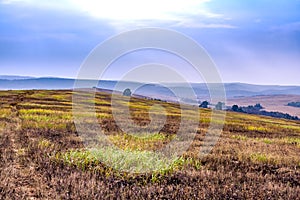 Beautiful autumn winter seasonal landscape view. Mountain view and foggy sky