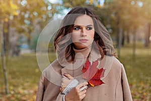 Beautiful autumn woman with long dark hair