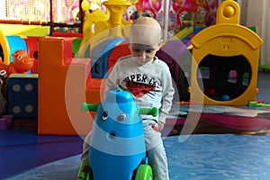 Beautiful baby boy playing at playland