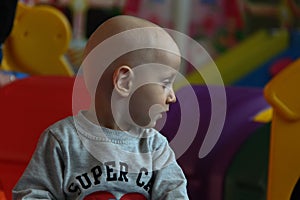 Beautiful baby boy playing at playland