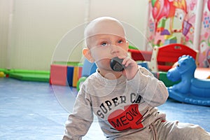 Beautiful baby boy playing at playland