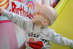 Beautiful baby boy playing at playland