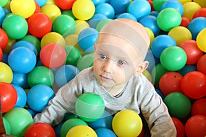 Beautiful baby boy playing at playland