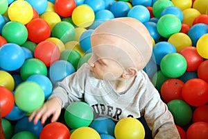 Beautiful baby boy playing at playland