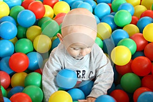 Beautiful baby boy playing at playland