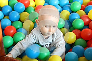 Beautiful baby boy playing at playland