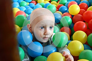 Beautiful baby boy playing at playland