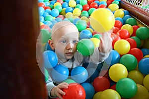 Beautiful baby boy playing at playland