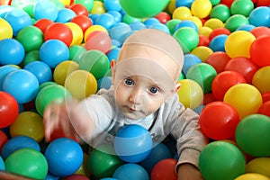 Beautiful baby boy playing at playland