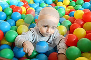 Beautiful baby boy playing at playland