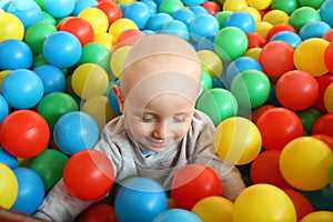 Beautiful baby boy playing at playland