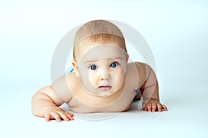 Beautiful baby close-up lying on the background