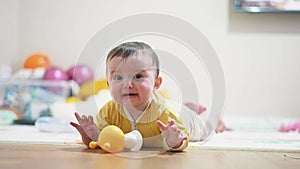 Beautiful baby crying unhappy. Little a baby girl learning to crawl on the floor crying unhappy annoyed. Baby sad
