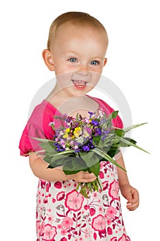 Beautiful baby girl with a posy of flowers