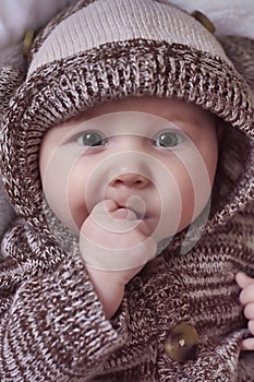 Beautiful Baby with Hands in Mouth
