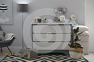 Beautiful baby room interior with changing table