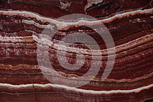 Beautiful background of natural stone onyx red with white veins, called Onice Fantastico photo