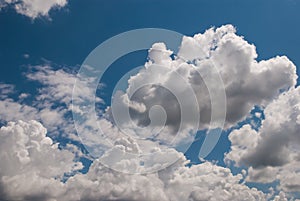 beautiful background with volumetric clouds on the blue sky