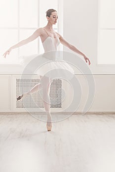 Beautiful ballerina dance in ballet position