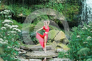 Beautiful ballerina performing outdoors in the nature